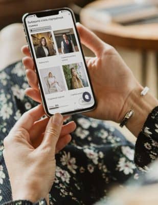 Phone screen mockup psd with hand holding in aesthetic beige widgets